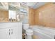 Bathroom featuring a white vanity and tiled shower-tub combo at 6633 Driftwood Dr, Hudson, FL 34667