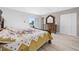 Bedroom featuring wood floors, large dresser with mirror, and closet at 6633 Driftwood Dr, Hudson, FL 34667