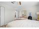 Relaxing bedroom features wood floors, comfortable furniture, and plenty of natural light at 6633 Driftwood Dr, Hudson, FL 34667