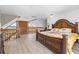 Bedroom with decorative wood bed frame and stairs leading up to a water view at 6633 Driftwood Dr, Hudson, FL 34667