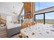 Open floor plan with dining area overlooking the living room and water views at 6633 Driftwood Dr, Hudson, FL 34667