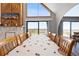Dining area showcases seating for eight and bright natural light with water views at 6633 Driftwood Dr, Hudson, FL 34667
