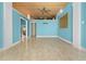 Bright living room with wooden ceilings, tiled floors, and view of outdoor space at 6633 Driftwood Dr, Hudson, FL 34667