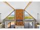 Living area with high ceilings, triangle windows and water views at 6633 Driftwood Dr, Hudson, FL 34667