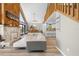 Bright living room boasts a wood accent wall, fireplace, and sliding doors to the outdoor deck at 6633 Driftwood Dr, Hudson, FL 34667