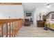 Cozy main bedroom featuring a hardwood floor, decorative furniture, and a balcony entrance at 6633 Driftwood Dr, Hudson, FL 34667