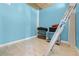 Storage room with tiled floors and neutral blue walls at 6633 Driftwood Dr, Hudson, FL 34667