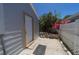 Side view of a backyard with a gravel bed and a storage shed at 6712 W Clifton St, Tampa, FL 33634