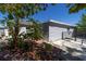 Backyard featuring tropical foliage and private outdoor space at 6712 W Clifton St, Tampa, FL 33634
