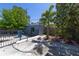 Fenced backyard area with concrete patio and a shed at 6712 W Clifton St, Tampa, FL 33634