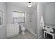 Bright bathroom features a walk-in shower, modern vanity, and sleek fixtures, offering a clean and contemporary design at 6712 W Clifton St, Tampa, FL 33634