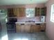 Kitchen featuring wood cabinets, stainless steel appliances, and light countertops at 710 E 129Th Ave, Tampa, FL 33612