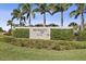 Landscaped entrance sign for Waterset by Newland community with mature palm trees in Apollo Beach, Florida at 7506 Sea Lilly Ct, Apollo Beach, FL 33572