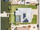 An aerial view of a home with a boat lift and solar panels, ideally located near waterfront for convenient access at 819 Birdie Way, Apollo Beach, FL 33572