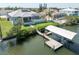 Waterfront property with a private dock, enclosed pool, and peaceful canal views at 819 Birdie Way, Apollo Beach, FL 33572