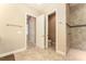Bathroom with tile flooring, neutral paint, and a walk-in shower at 819 Birdie Way, Apollo Beach, FL 33572