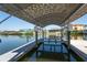 Boat lift with canopy for easy access to the waterfront for boating activities at 819 Birdie Way, Apollo Beach, FL 33572