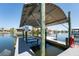 Covered boat lift providing convenient water access and protection for your vessel at 819 Birdie Way, Apollo Beach, FL 33572