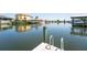 Waterfront dock with ladder for easy access to the canal, ideal for boating at 819 Birdie Way, Apollo Beach, FL 33572