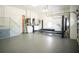 Spacious garage with a car lift and stairs to an upper level at 819 Birdie Way, Apollo Beach, FL 33572