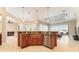 Gourmet kitchen island featuring granite countertops and stainless steel appliances at 819 Birdie Way, Apollo Beach, FL 33572