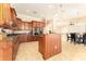 Spacious kitchen featuring wood cabinetry, granite countertops, and stainless steel appliances at 819 Birdie Way, Apollo Beach, FL 33572