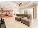 Open-concept living room showcasing tile floors, comfortable seating, and views into the kitchen at 819 Birdie Way, Apollo Beach, FL 33572