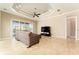 Bright living room with tile floors, recessed lighting, and sliding glass doors overlooking the water at 819 Birdie Way, Apollo Beach, FL 33572