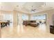 Bright and airy living room with tile floors and sliding glass doors leading to the pool at 819 Birdie Way, Apollo Beach, FL 33572