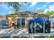 A view of the backyard featuring a shed, patio, and sliding glass door at 8528 Quarter Horse Dr, Riverview, FL 33578