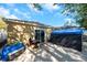 Wide backyard patio featuring a shed, sliding glass door, and space for outdoor activities at 8528 Quarter Horse Dr, Riverview, FL 33578