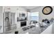 Bright kitchen with white cabinets, stainless steel appliances, and granite countertops at 8528 Quarter Horse Dr, Riverview, FL 33578
