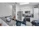Well-equipped kitchen featuring stainless steel appliances, granite countertops, and modern fixtures at 8528 Quarter Horse Dr, Riverview, FL 33578