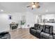 Inviting living room featuring plank floors, fireplace, and stylish furnishings at 8528 Quarter Horse Dr, Riverview, FL 33578