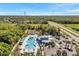 Aerial view of community pool, parking lot, and surrounding area at 8528 Quarter Horse Dr, Riverview, FL 33578