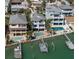 Beautiful elevated waterfront homes featuring a private pools, docks, and boat lifts with coastal charm at 8685 E Bay Dr, Treasure Island, FL 33706
