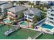 Lovely waterfront homes with private pools and docks perfect for relaxing and entertaining in coastal bliss at 8685 E Bay Dr, Treasure Island, FL 33706