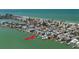 Stunning coastal home on stilts with a private dock and boats along a tranquil waterfront at 8685 E Bay Dr, Treasure Island, FL 33706