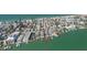 Aerial view showcasing the property's prime location and proximity to the waterfront and surrounding neighborhood at 8685 E Bay Dr, Treasure Island, FL 33706