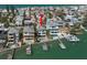 Beautiful elevated waterfront home featuring a private pool, dock, and boat lift with coastal charm at 8685 E Bay Dr, Treasure Island, FL 33706