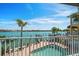 Waterfront backyard with a pool and dock at 8685 E Bay Dr, Treasure Island, FL 33706