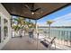 Charming balcony with waterfront views and comfortable seating at 8685 E Bay Dr, Treasure Island, FL 33706