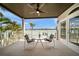 Outdoor balcony with seating and stunning waterfront views at 8685 E Bay Dr, Treasure Island, FL 33706