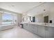 Bright bathroom with a soaking tub, expansive vanity, and lots of space to get ready for the day at 8685 E Bay Dr, Treasure Island, FL 33706