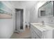 Bright bathroom featuring tile shower, vanity, and updated sink at 8685 E Bay Dr, Treasure Island, FL 33706