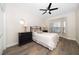 Comfortable bedroom with bay window, ceiling fan, and wooden floors at 8685 E Bay Dr, Treasure Island, FL 33706