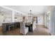 Open concept dining area featuring an eat-in kitchen with a large island and modern decor at 8685 E Bay Dr, Treasure Island, FL 33706