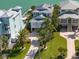 Attractive coastal home with lush landscaping, a paved driveway, and stunning curb appeal in a serene setting at 8685 E Bay Dr, Treasure Island, FL 33706