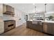 Spacious kitchen features modern stainless-steel appliances, island, and granite countertops at 8685 E Bay Dr, Treasure Island, FL 33706