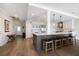 This open-concept kitchen features an island with seating and stainless-steel appliances at 8685 E Bay Dr, Treasure Island, FL 33706